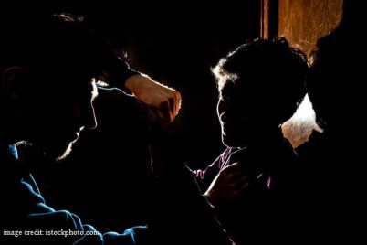 silhouette of two young guys in the dark place bully and fight concept